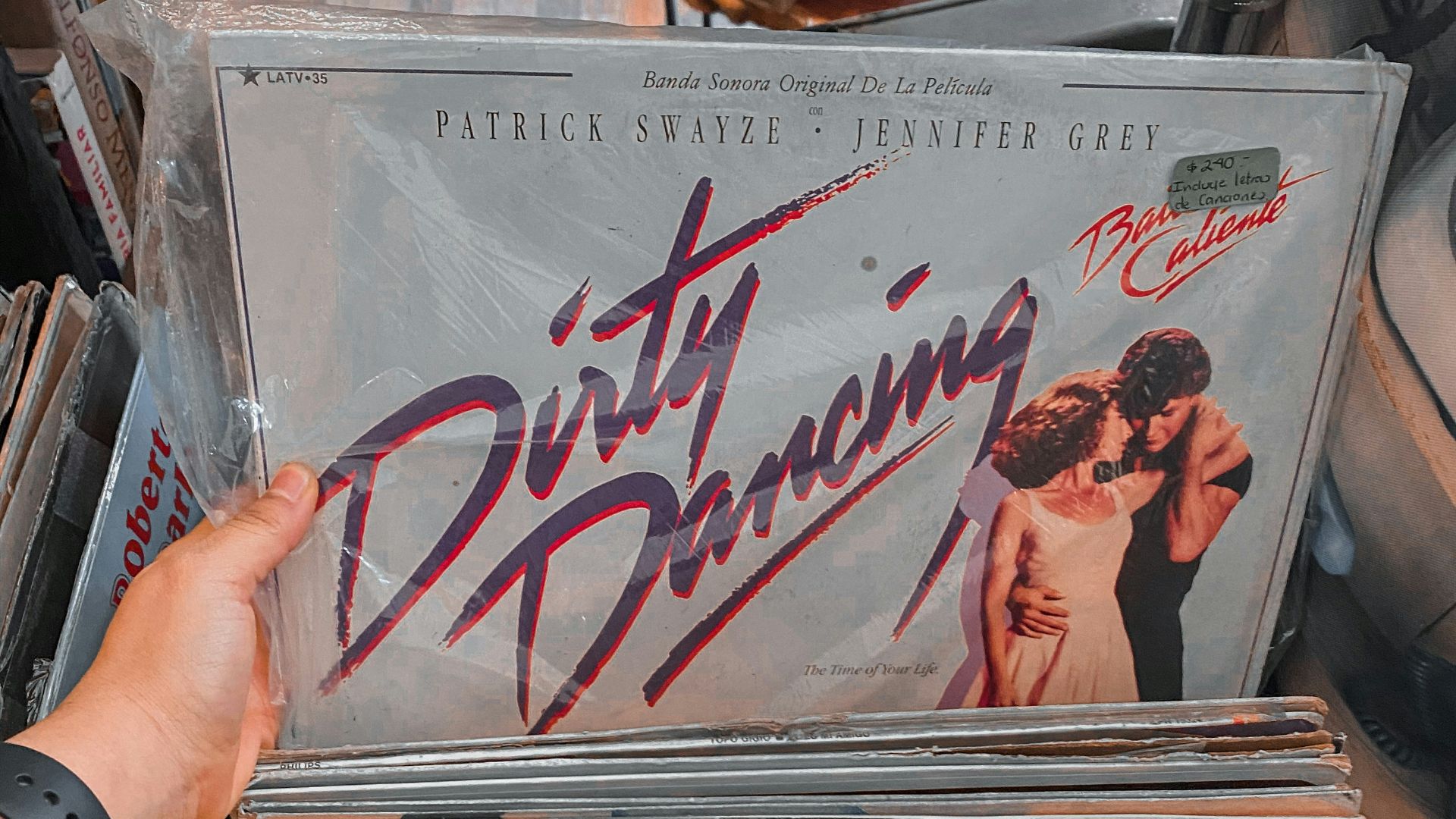 person holding white and black vinyl record