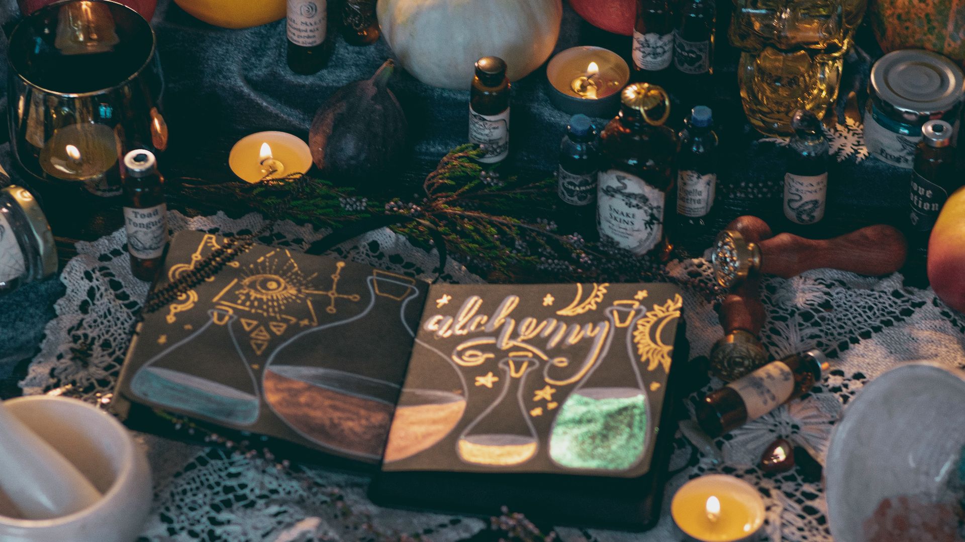 red apple fruit beside silver and gold buddha figurine