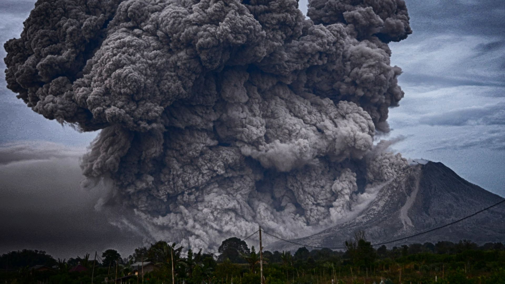 volcano eruption during daytime