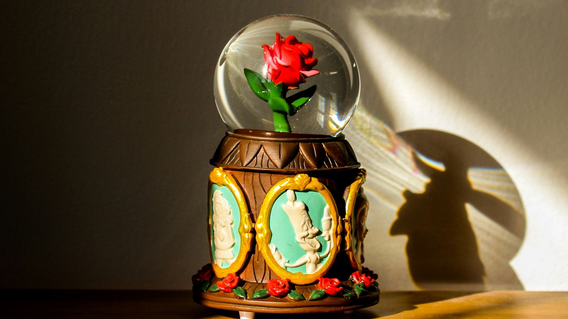 clear glass ball with snow man and woman print