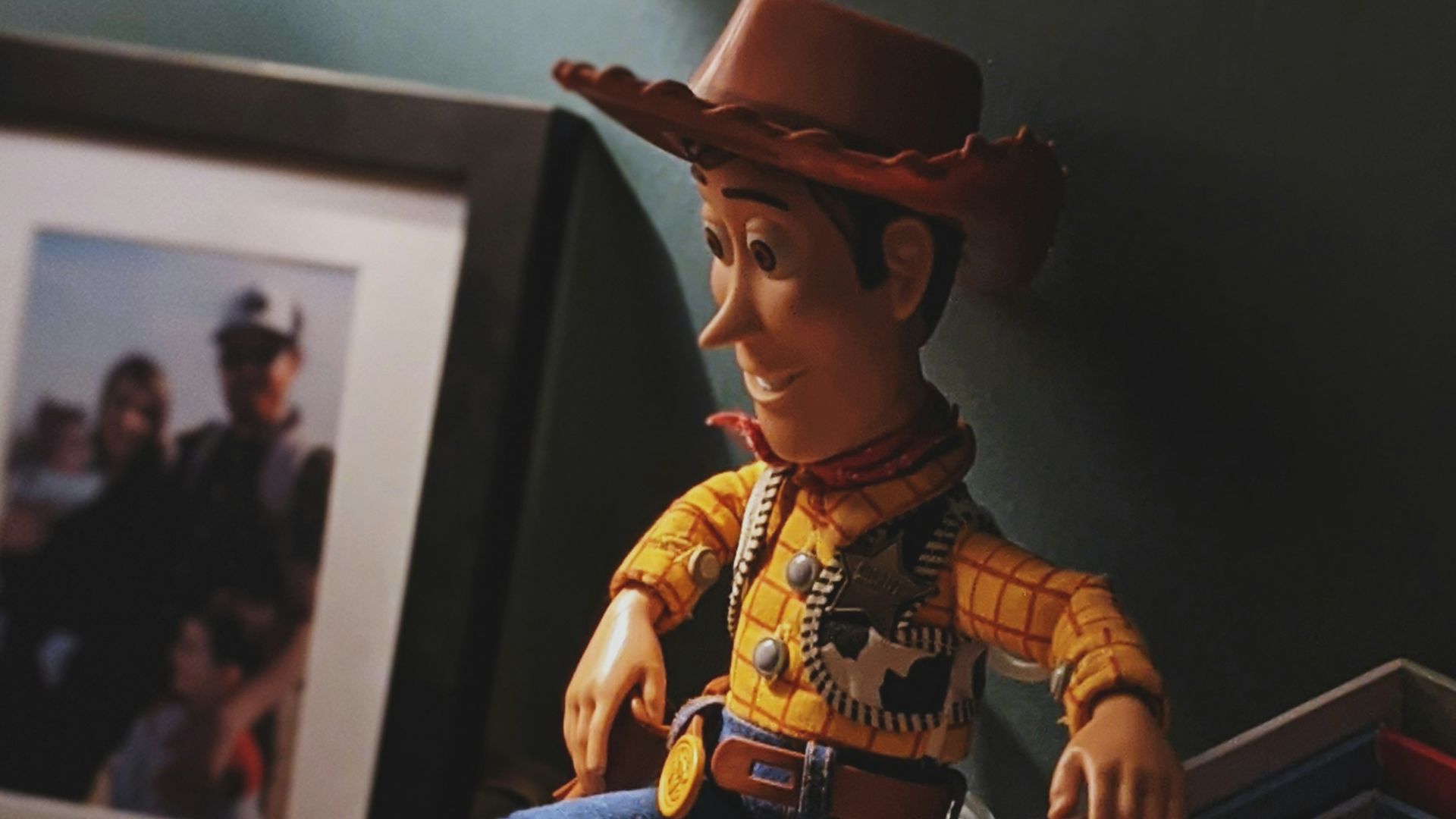 boy in cowboy costume standing on wooden box