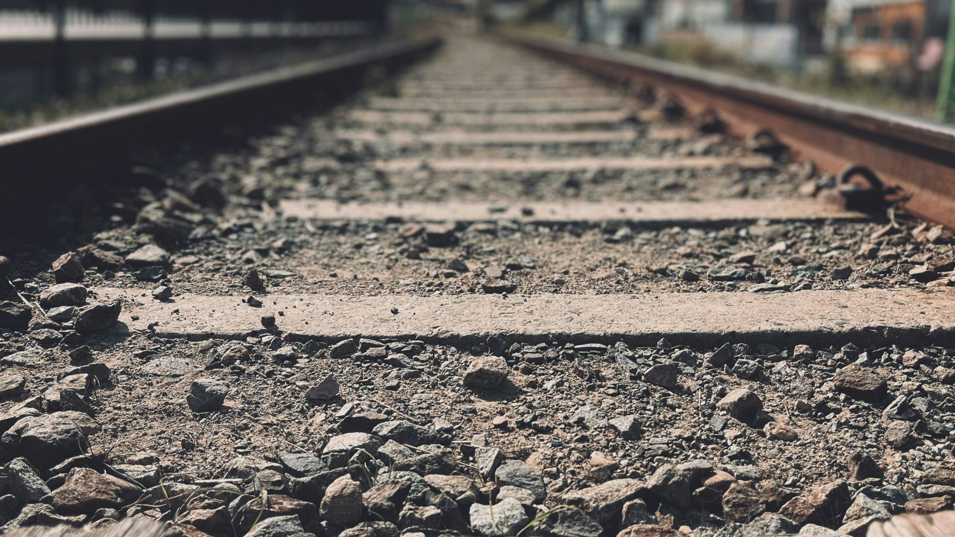 a train track with a few rocks on it