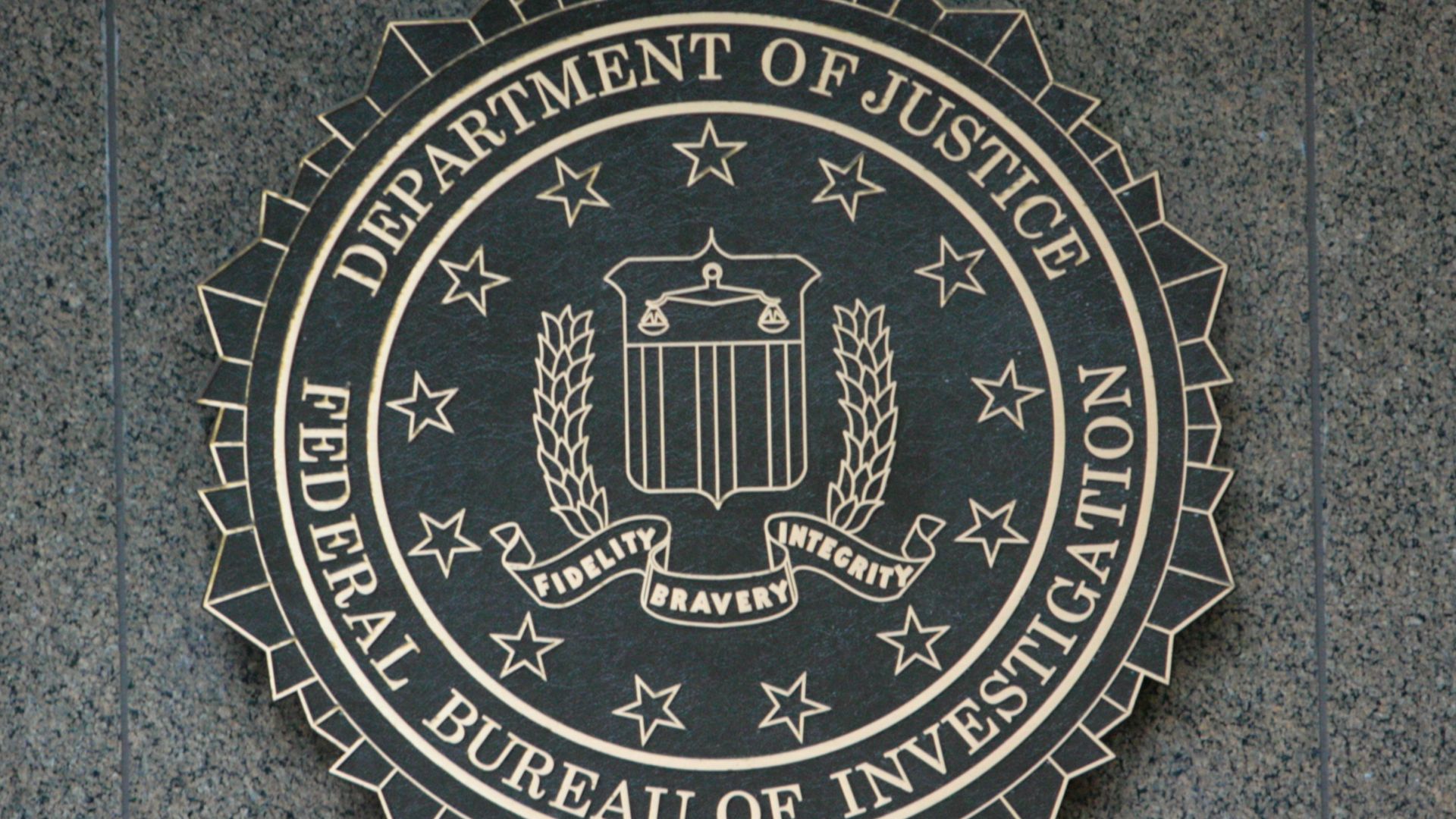 the seal of the department of justice on a wall