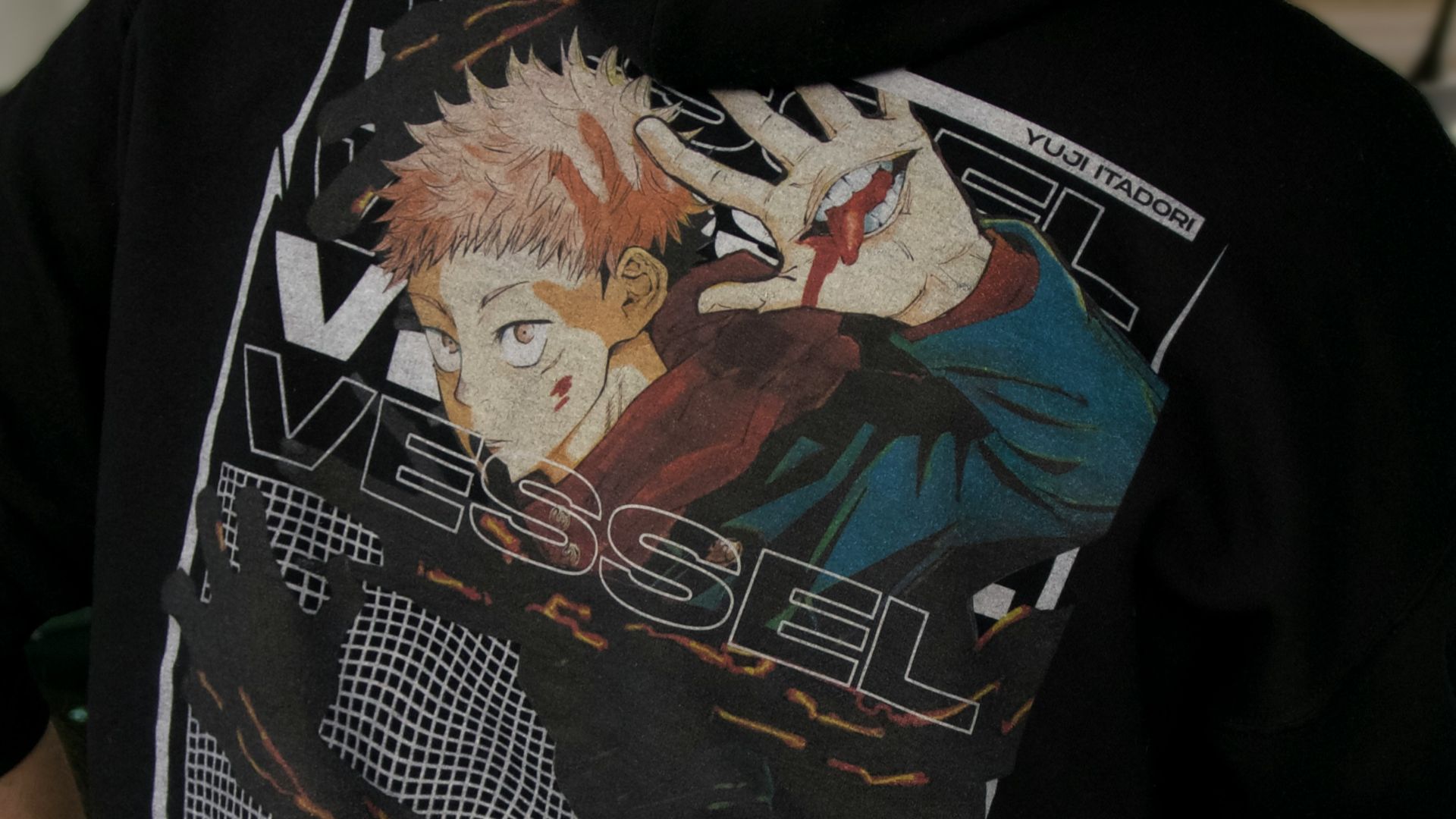 a person wearing a black hoodie