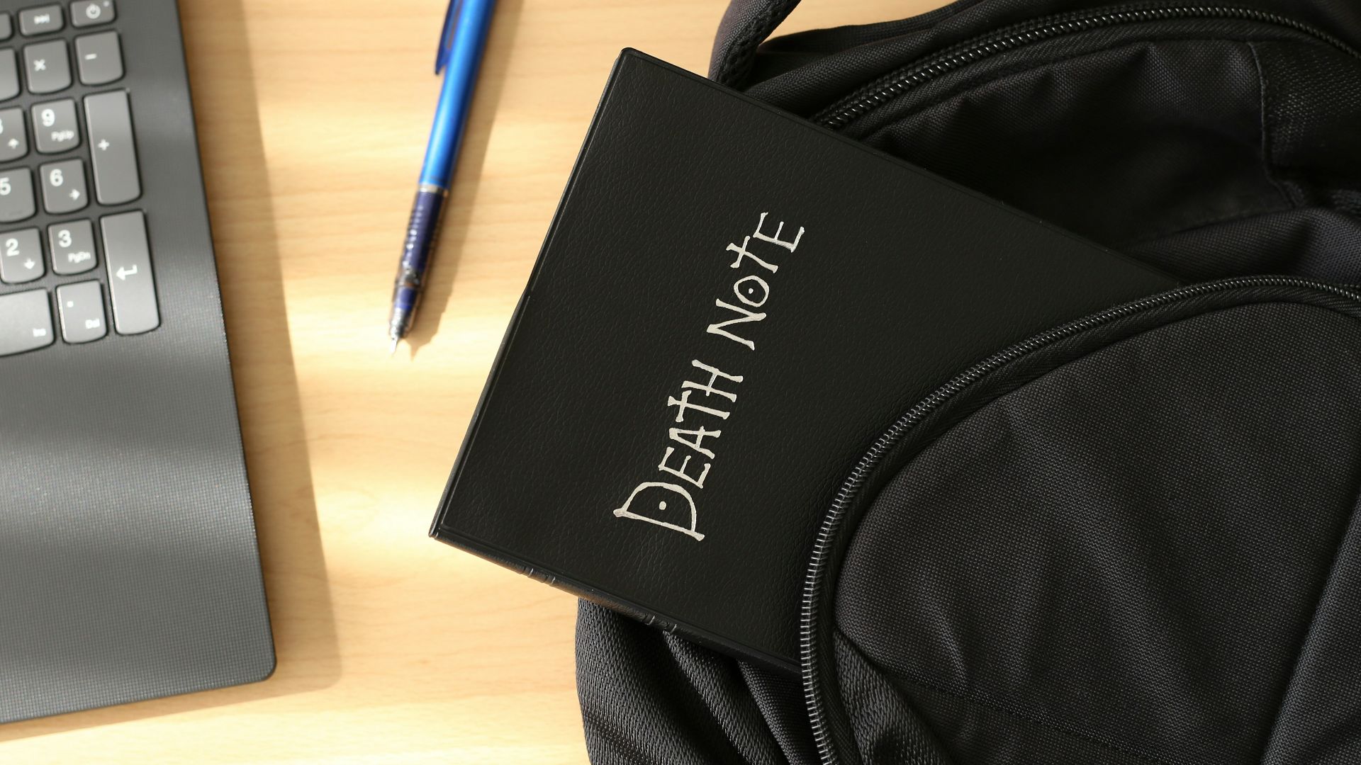 a bag and a laptop on a table