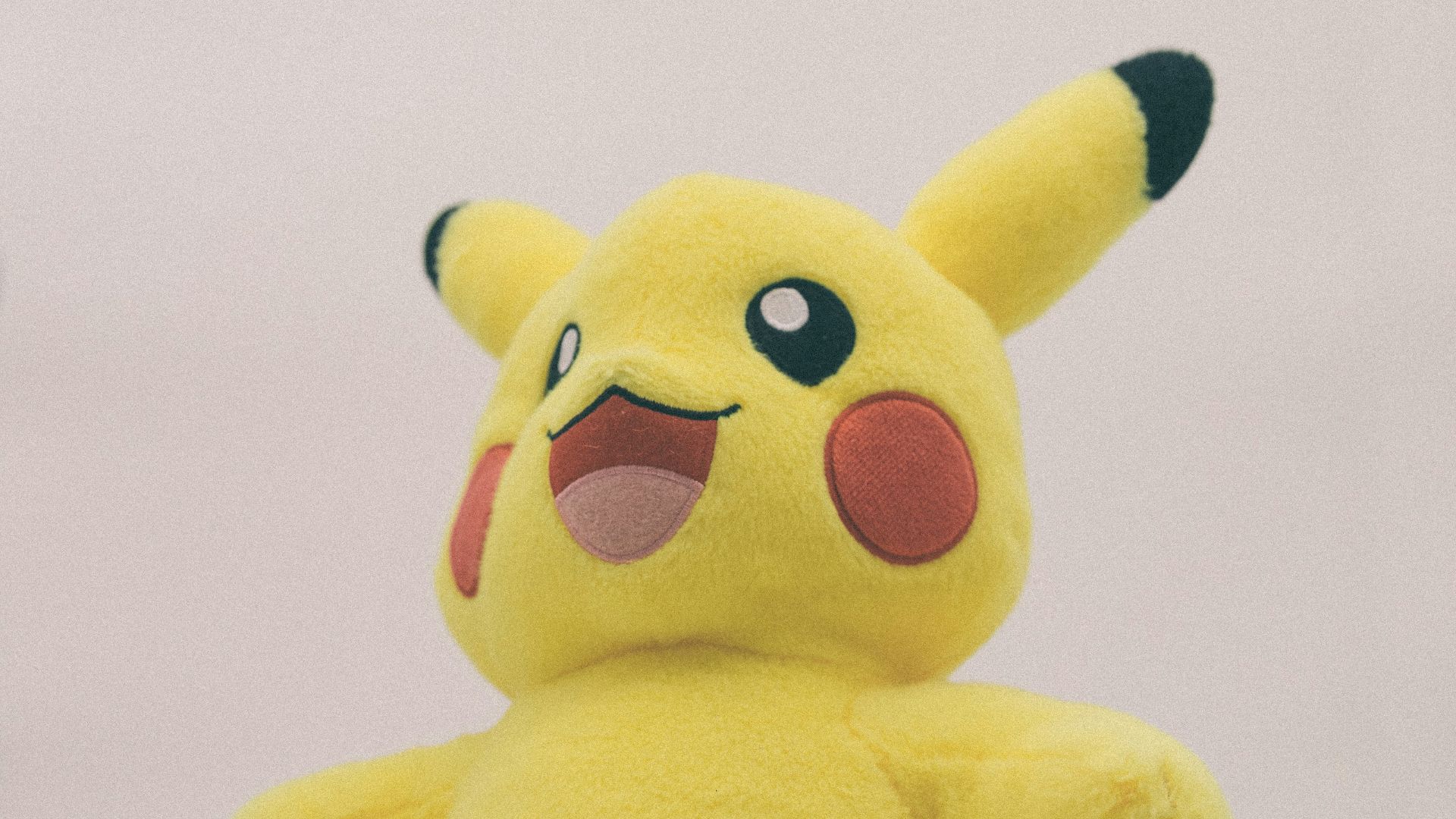 yellow and black bear plush toy