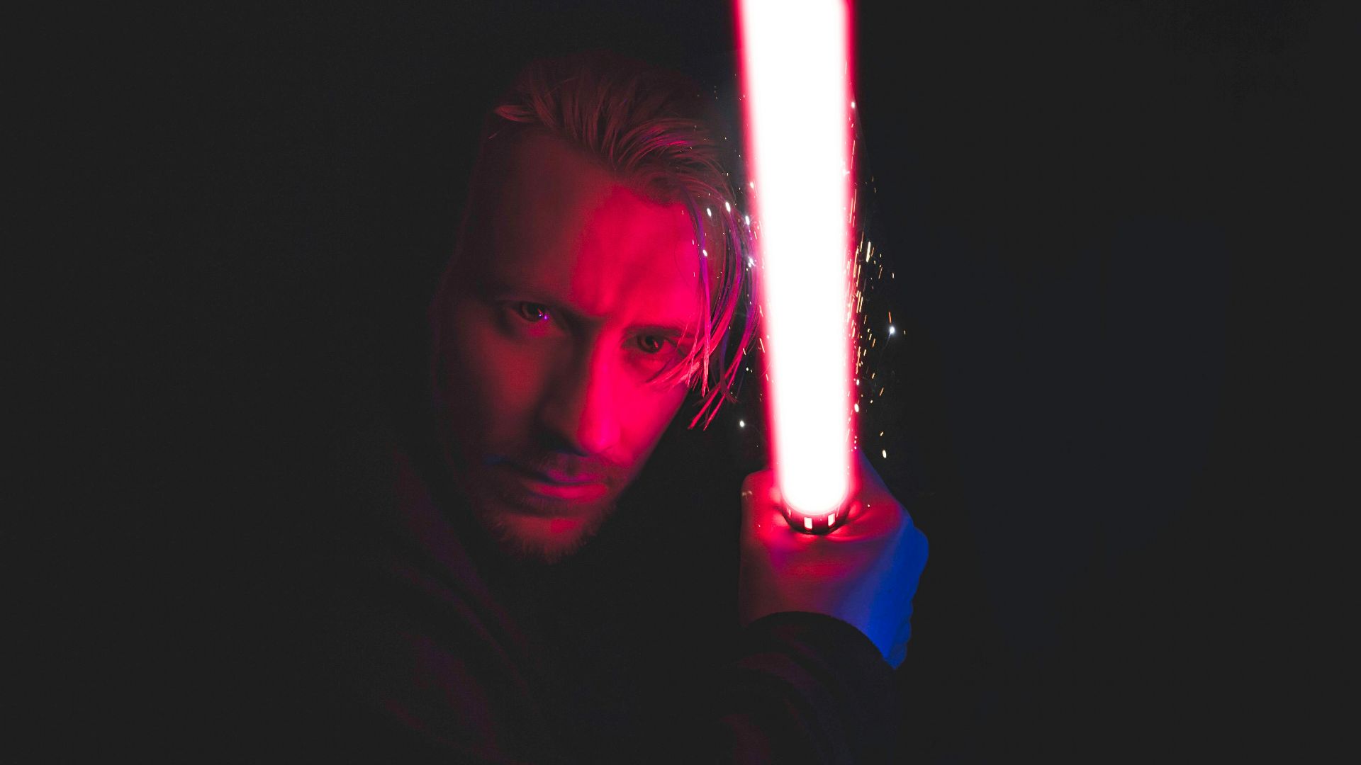 person holding red lightsaber