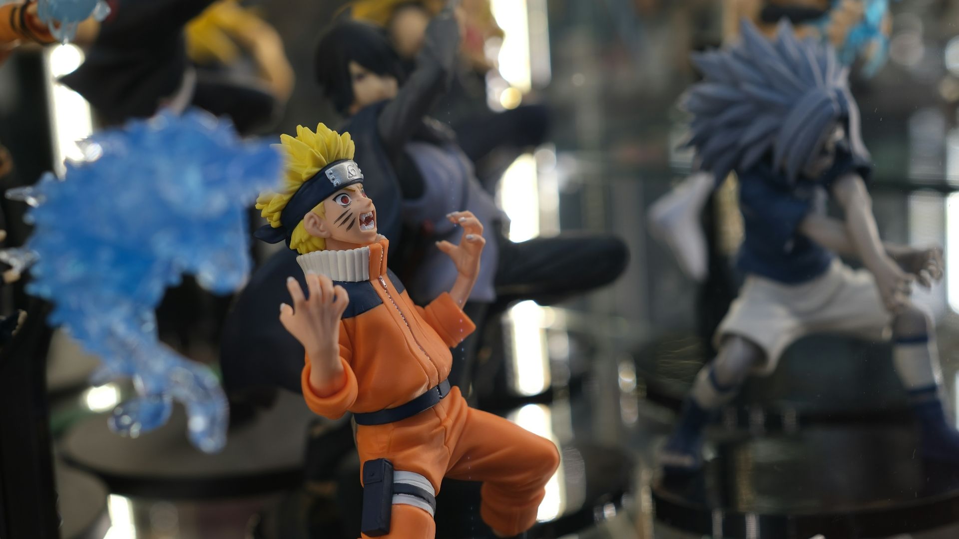 a collection of action figures sitting on top of a table