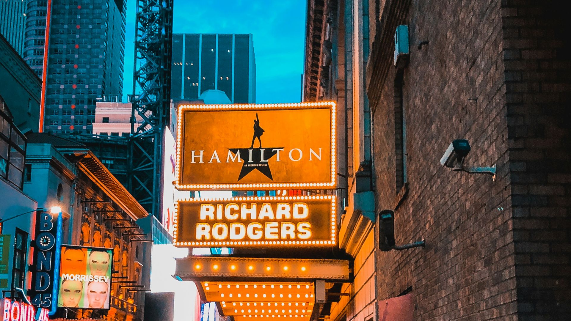 people walking on street during night time