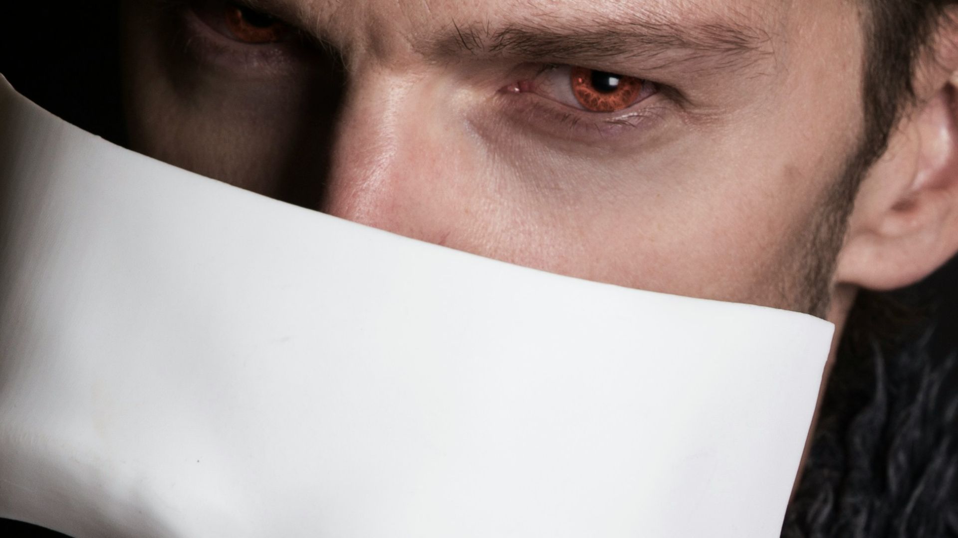 man with white face mask