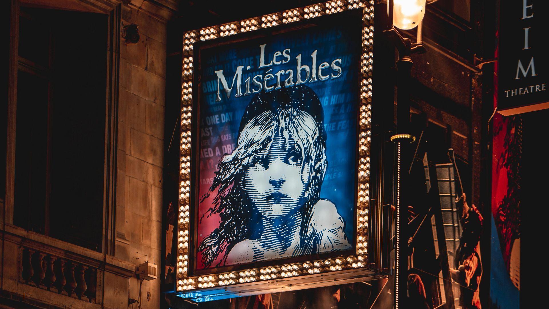 cars parked in front of the building during night time