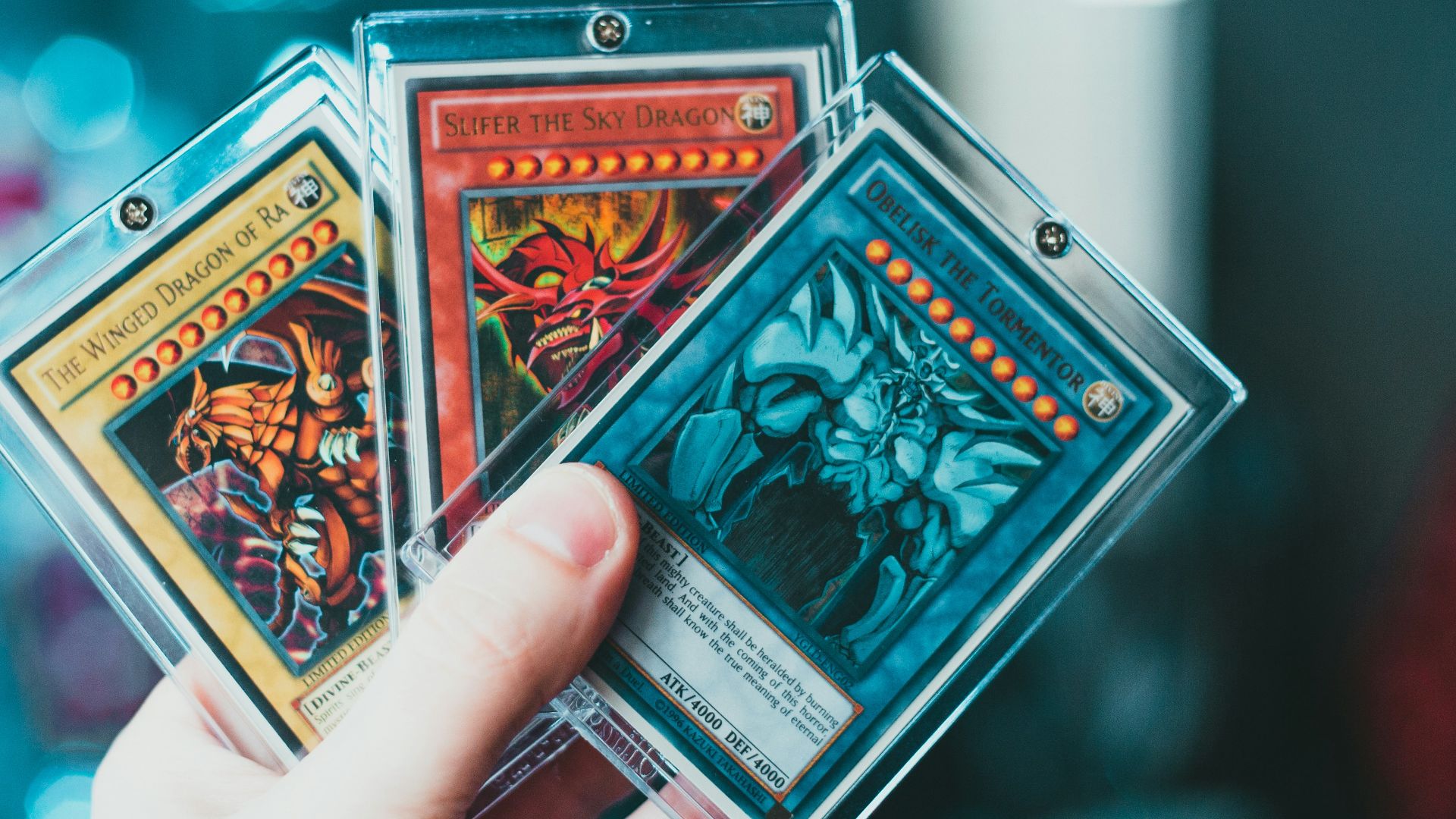 person holding yu gi oh trading card