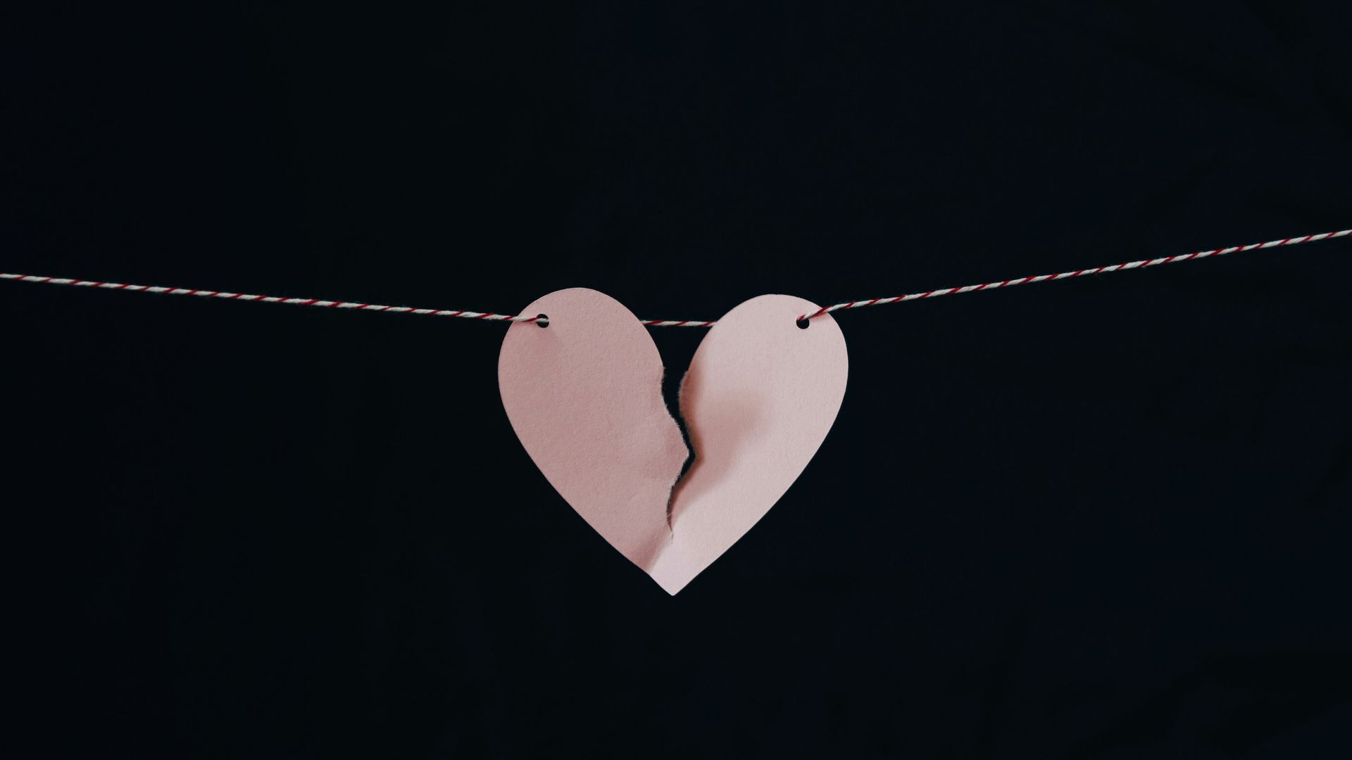 broken heart hanging on wire