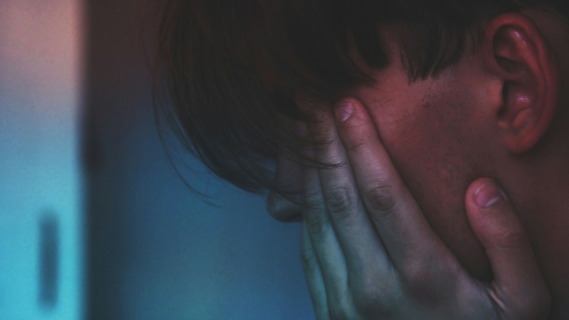 man holding smartphone in close up photography