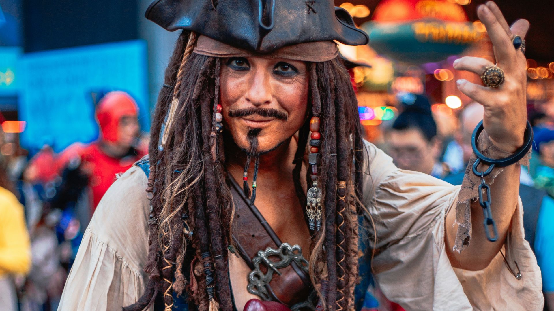 A man with dreadlocks and a pirate costume