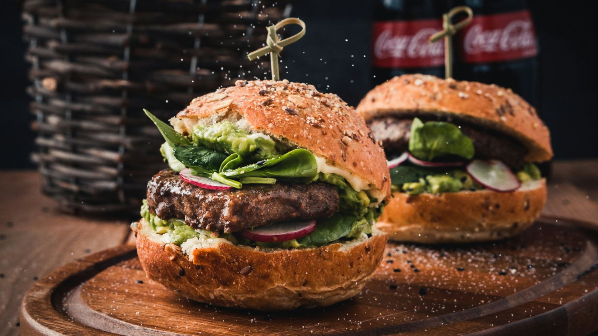 burger with vegetable on brown wooden tray