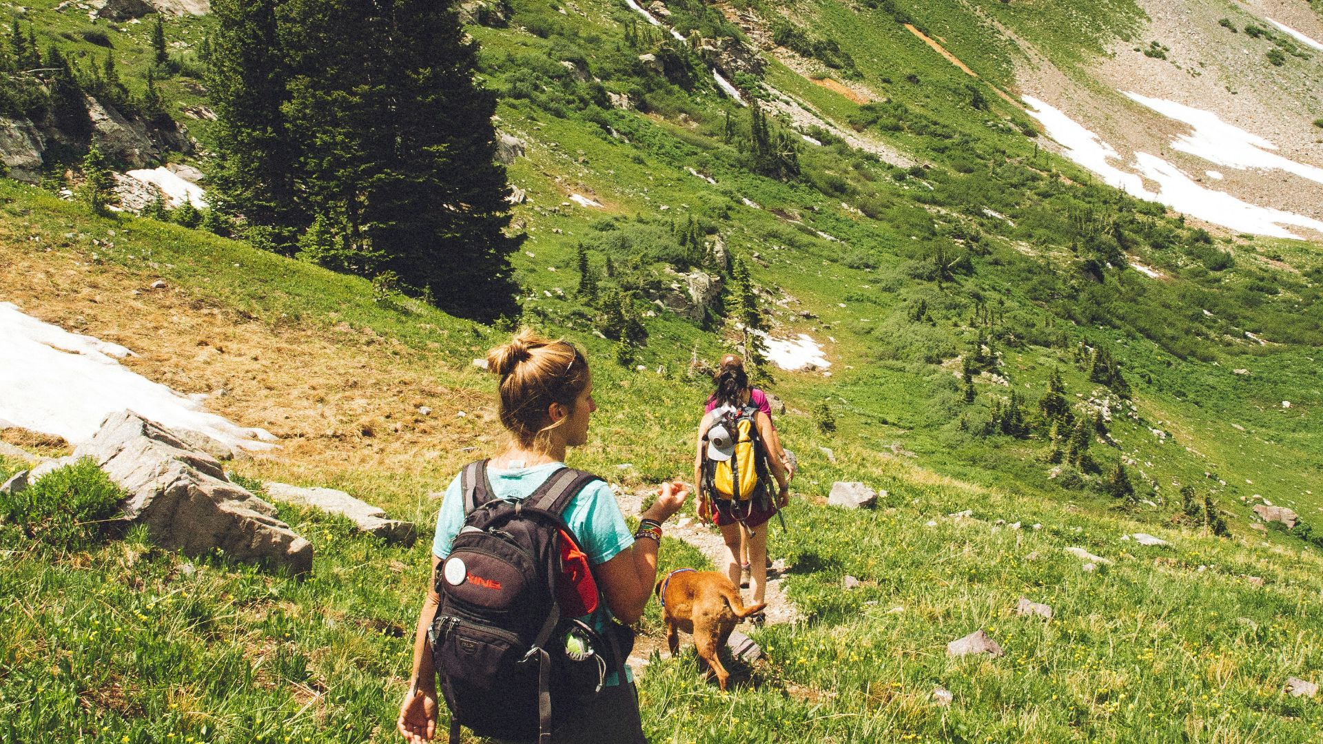 woman walking down the hill at daytime
