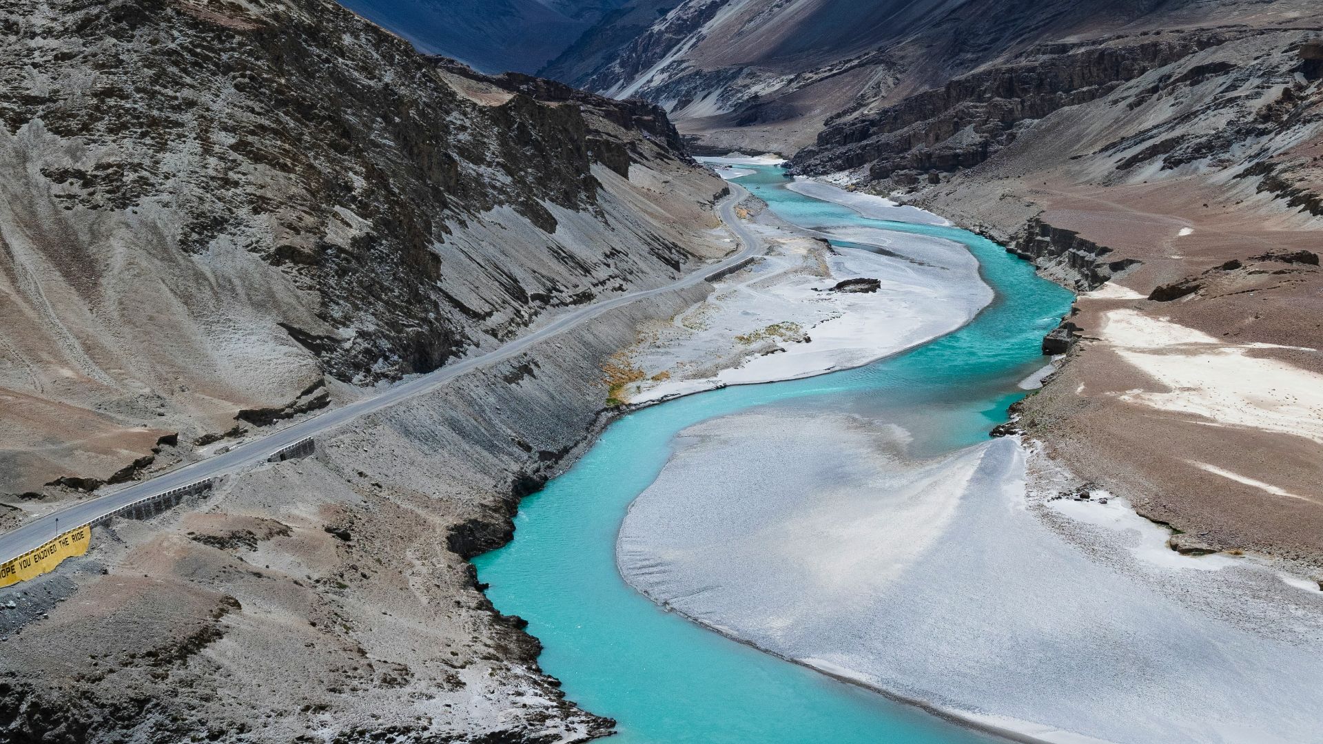 lake in the middle of mountains during daytime