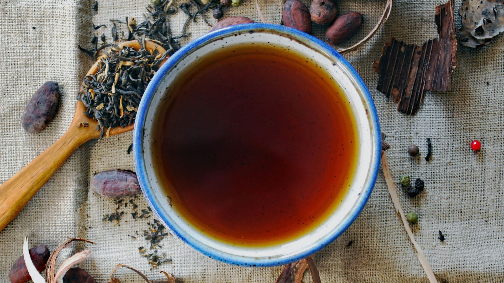 white and brown ceramic mug
