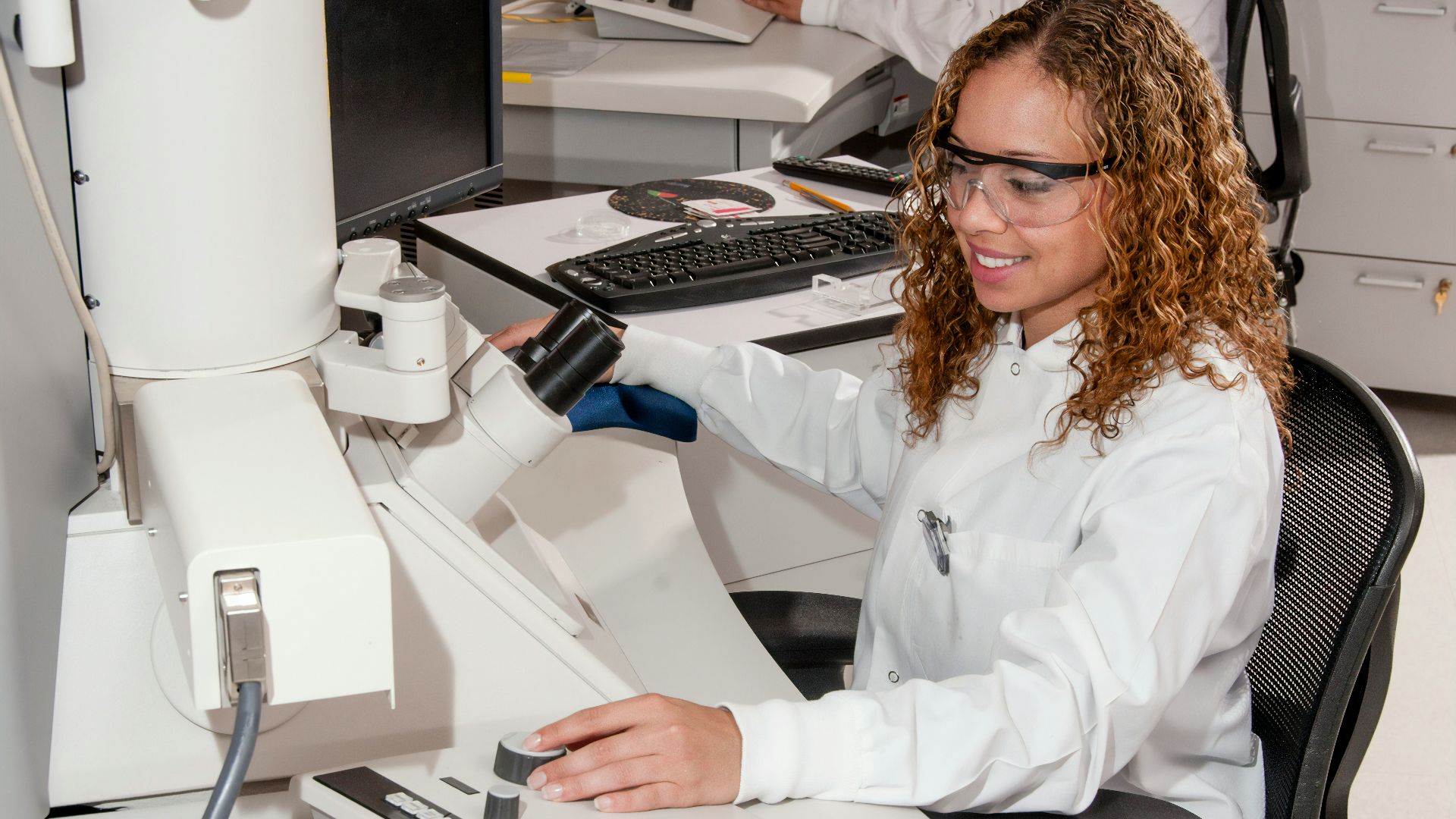woman in white button up long sleeve shirt sitting on chair