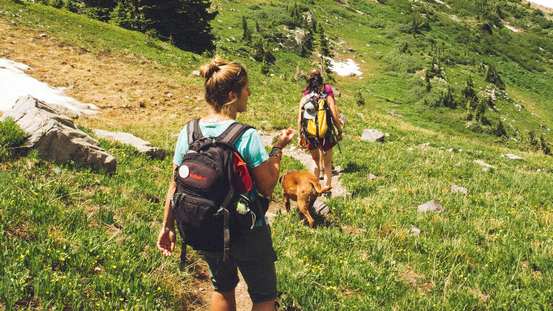 woman walking down the hill at daytime
