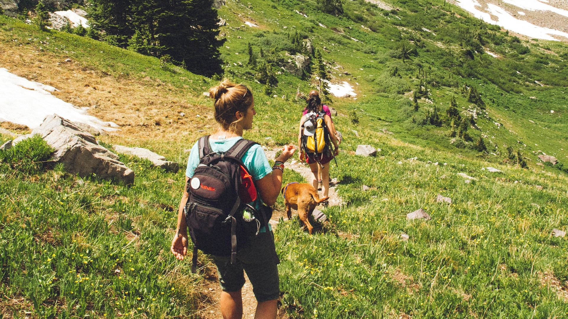 woman walking down the hill at daytime