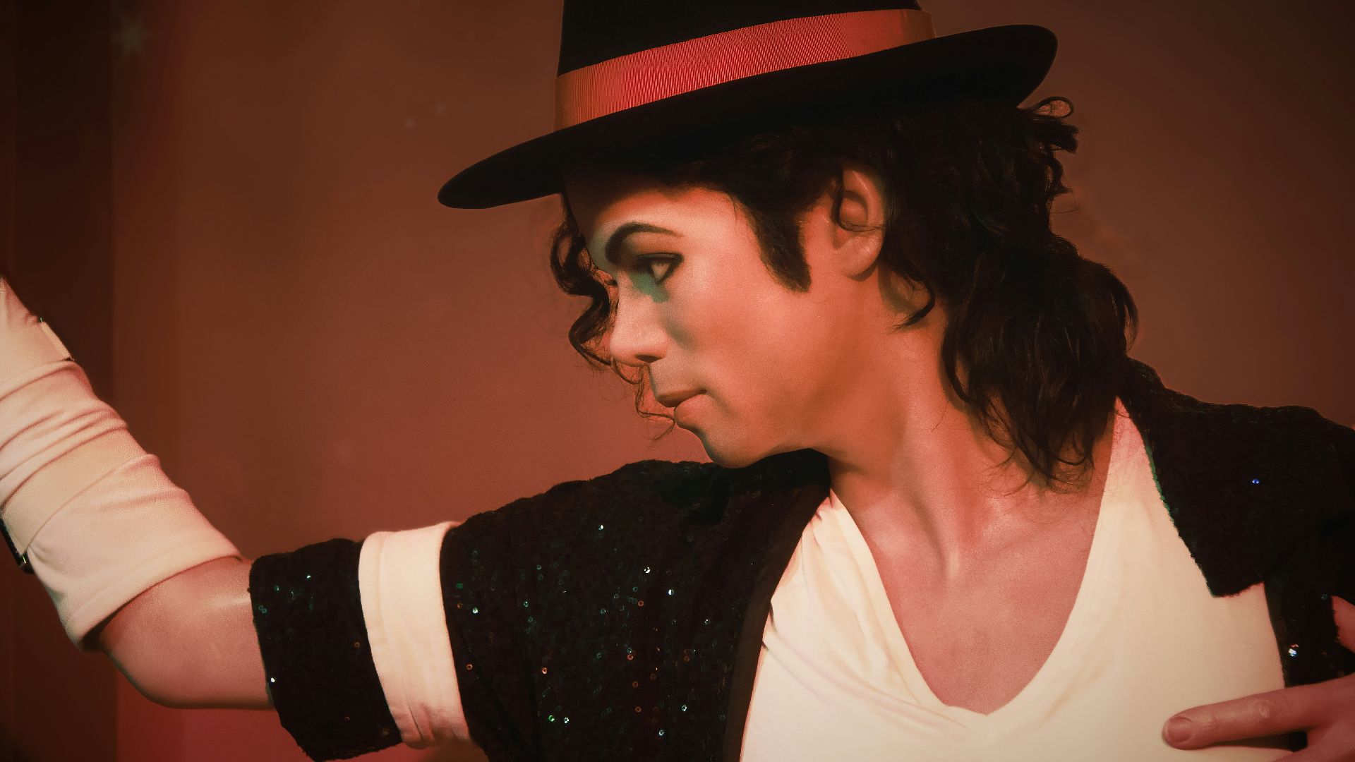 a man in a top hat and black jacket