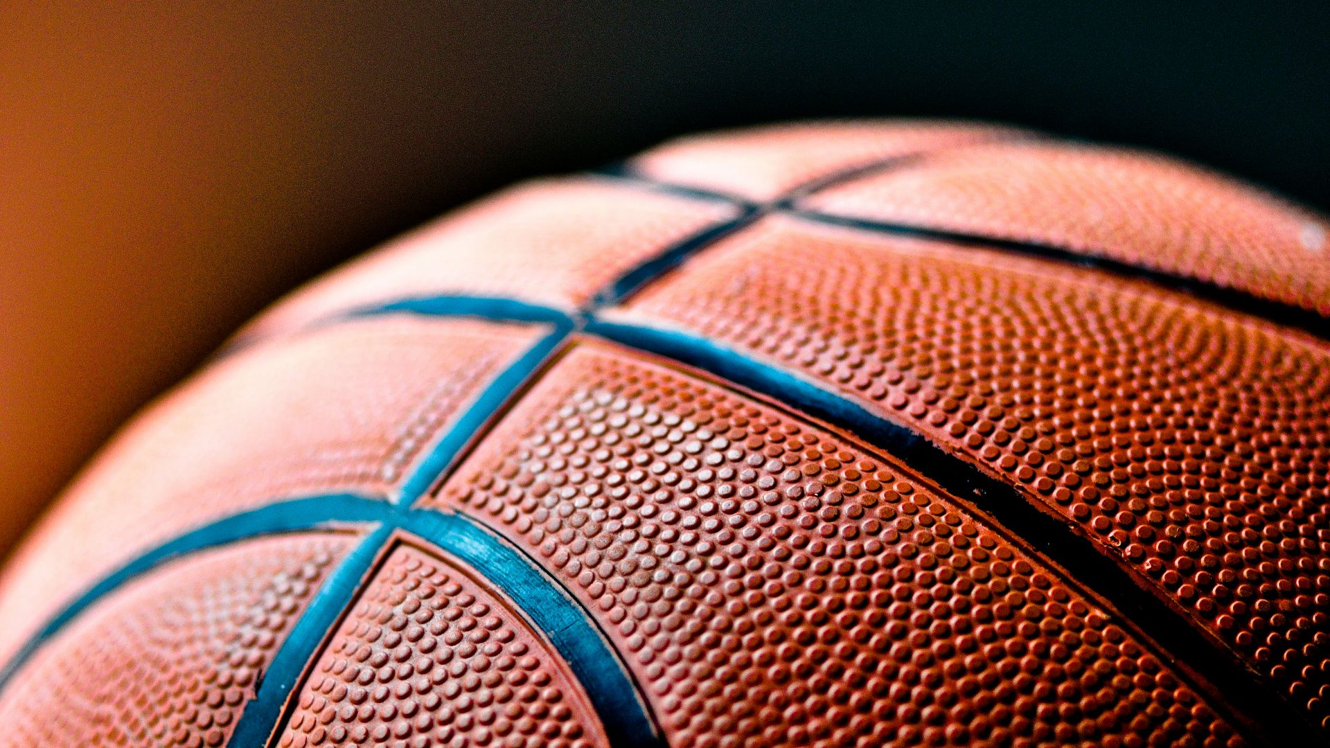 brown and black basketball ball