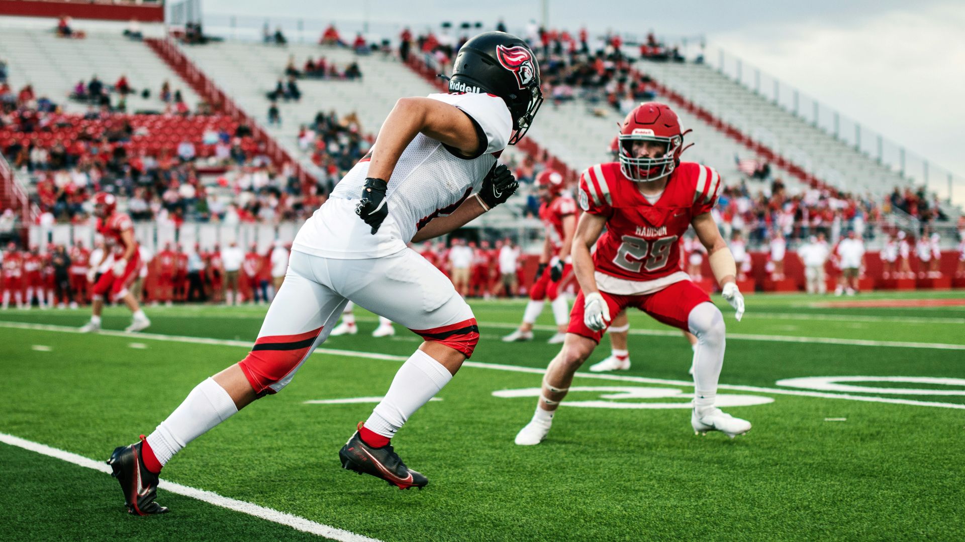 football players on field during daytime