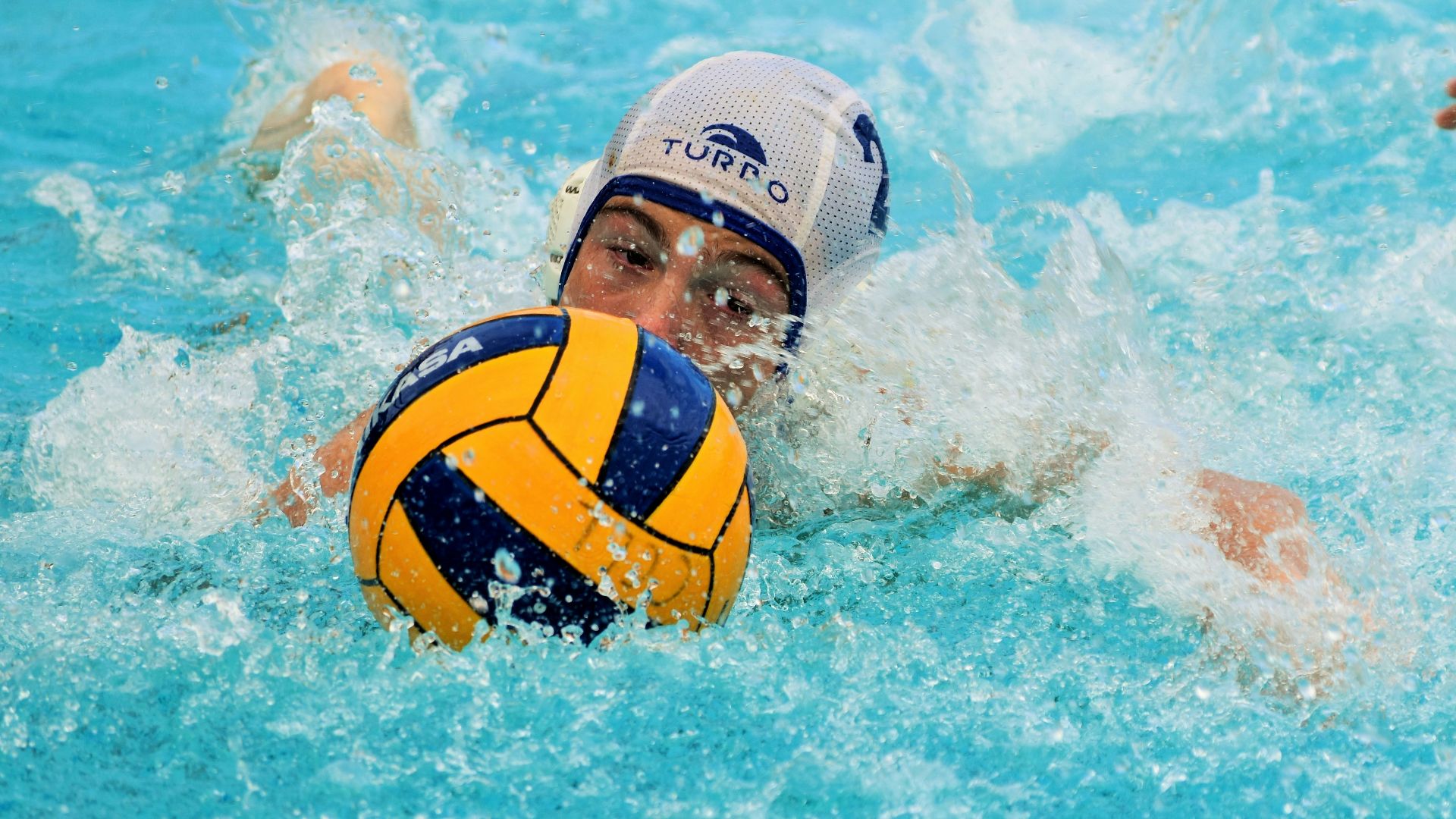 yellow and blue soccer ball in water