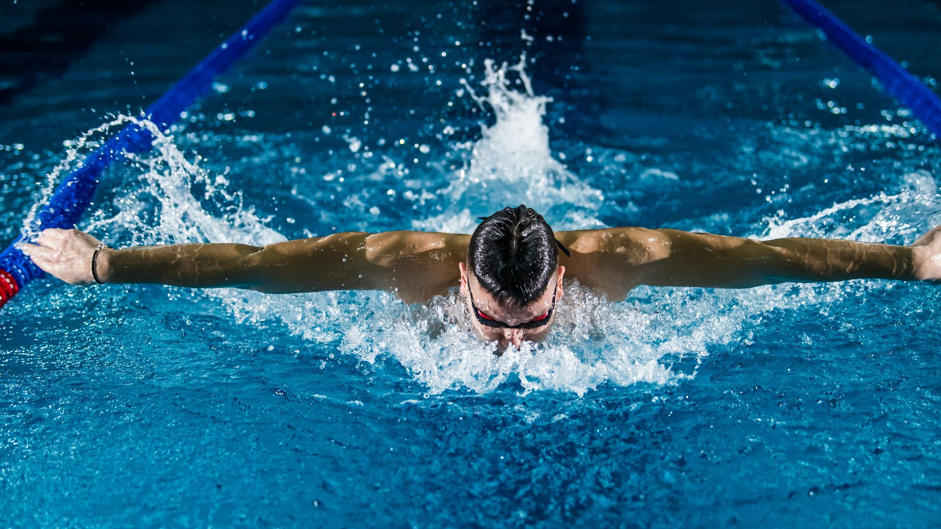 man doing butterfly stroke
