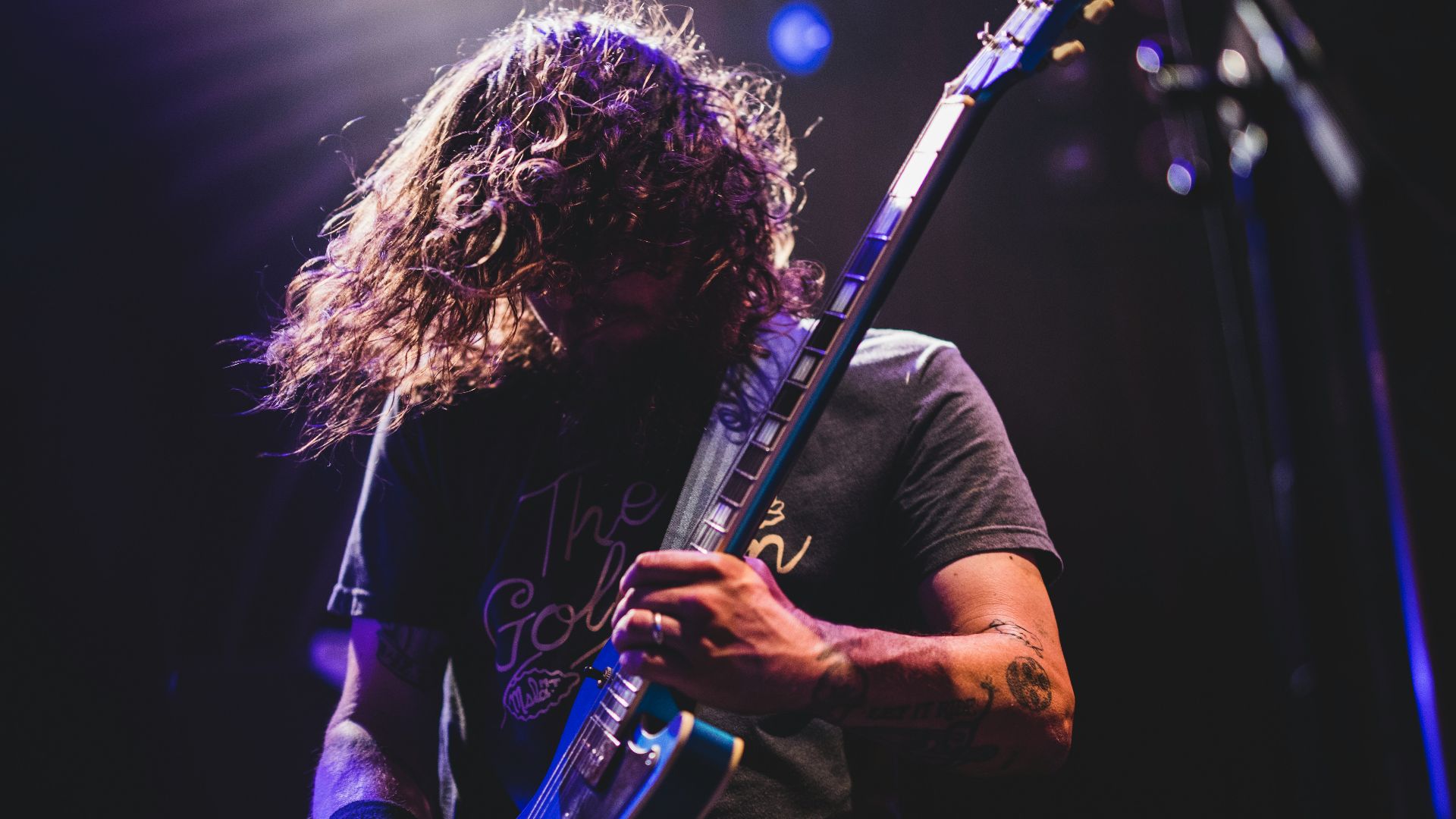 man playing electric guitar