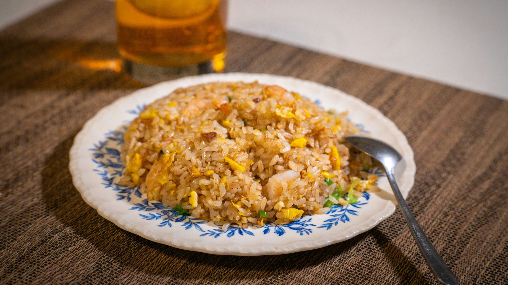 white ceramic plate with rice and stainless steel fork