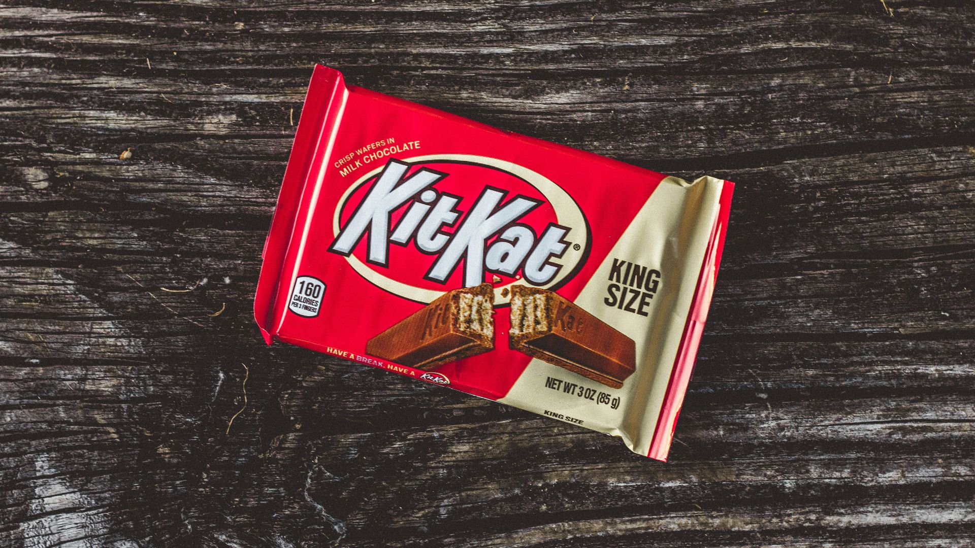 kitkat chocolate pack on black textile