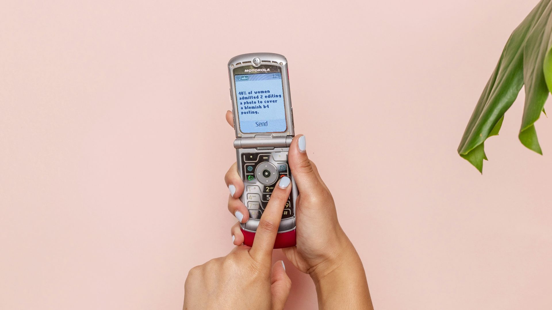 turned-on silver flip phone