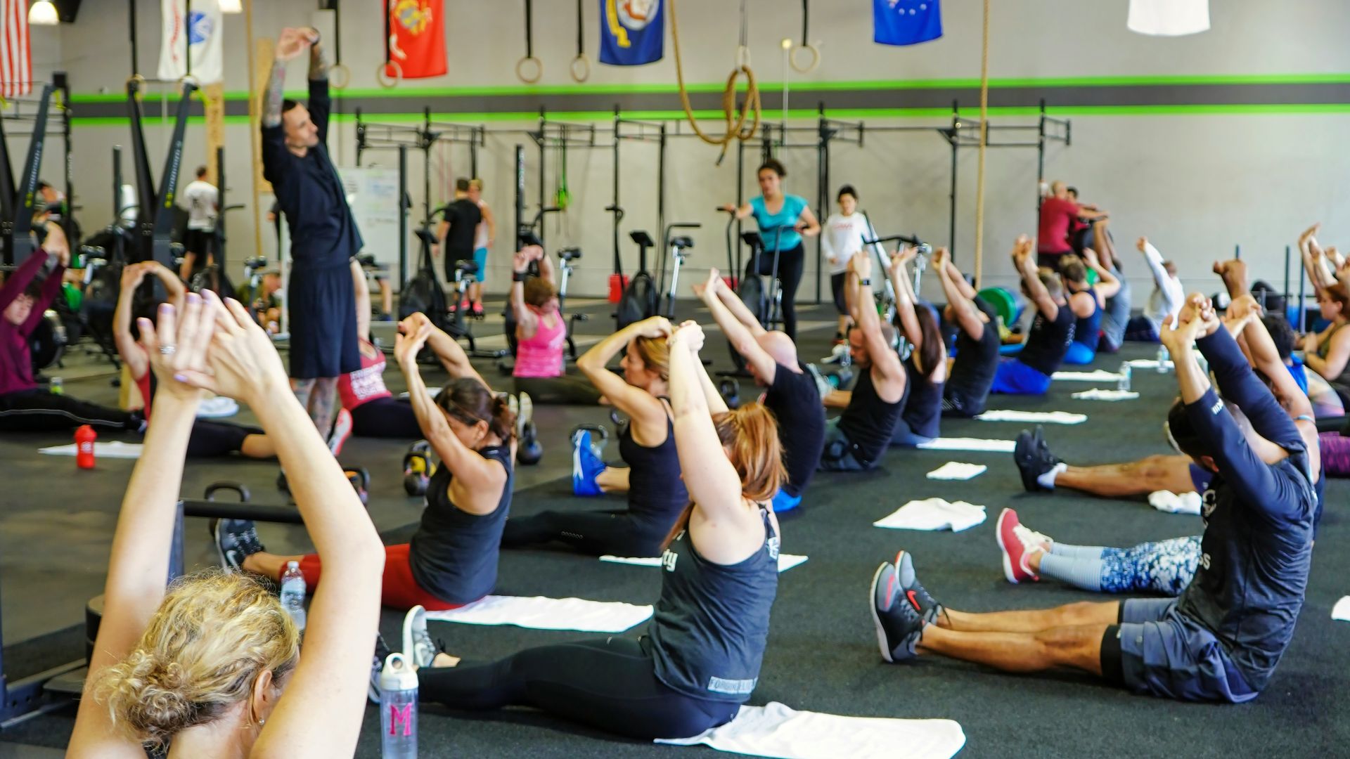 people doing yoga inside gym