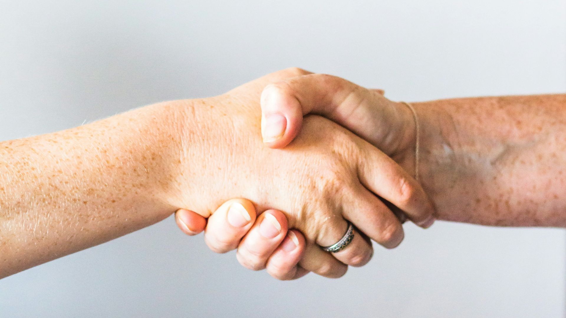 person holding hands of another person