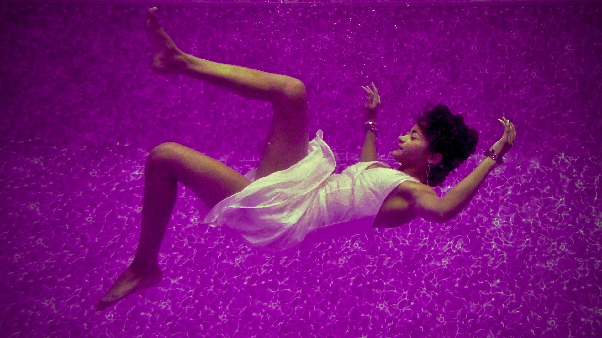 woman falls on purple surface