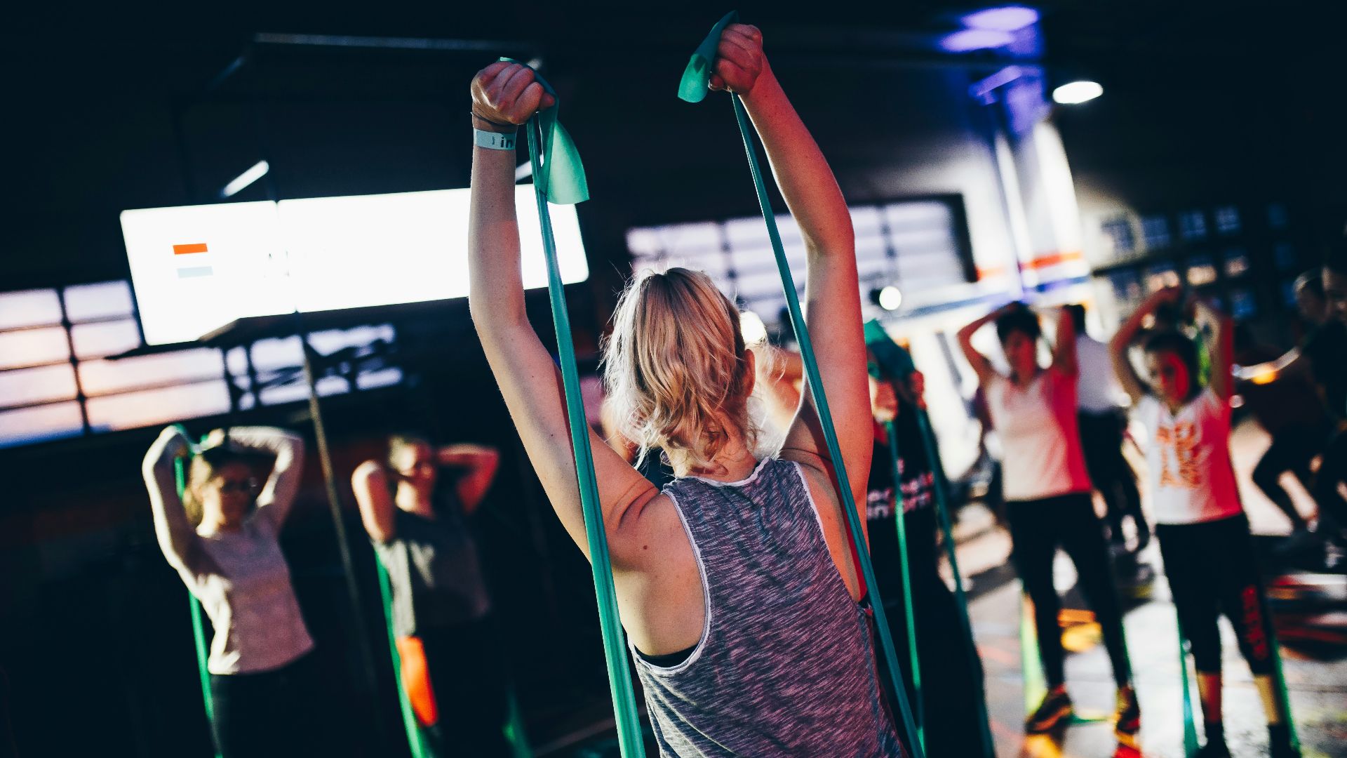 group of people in gym while exercising