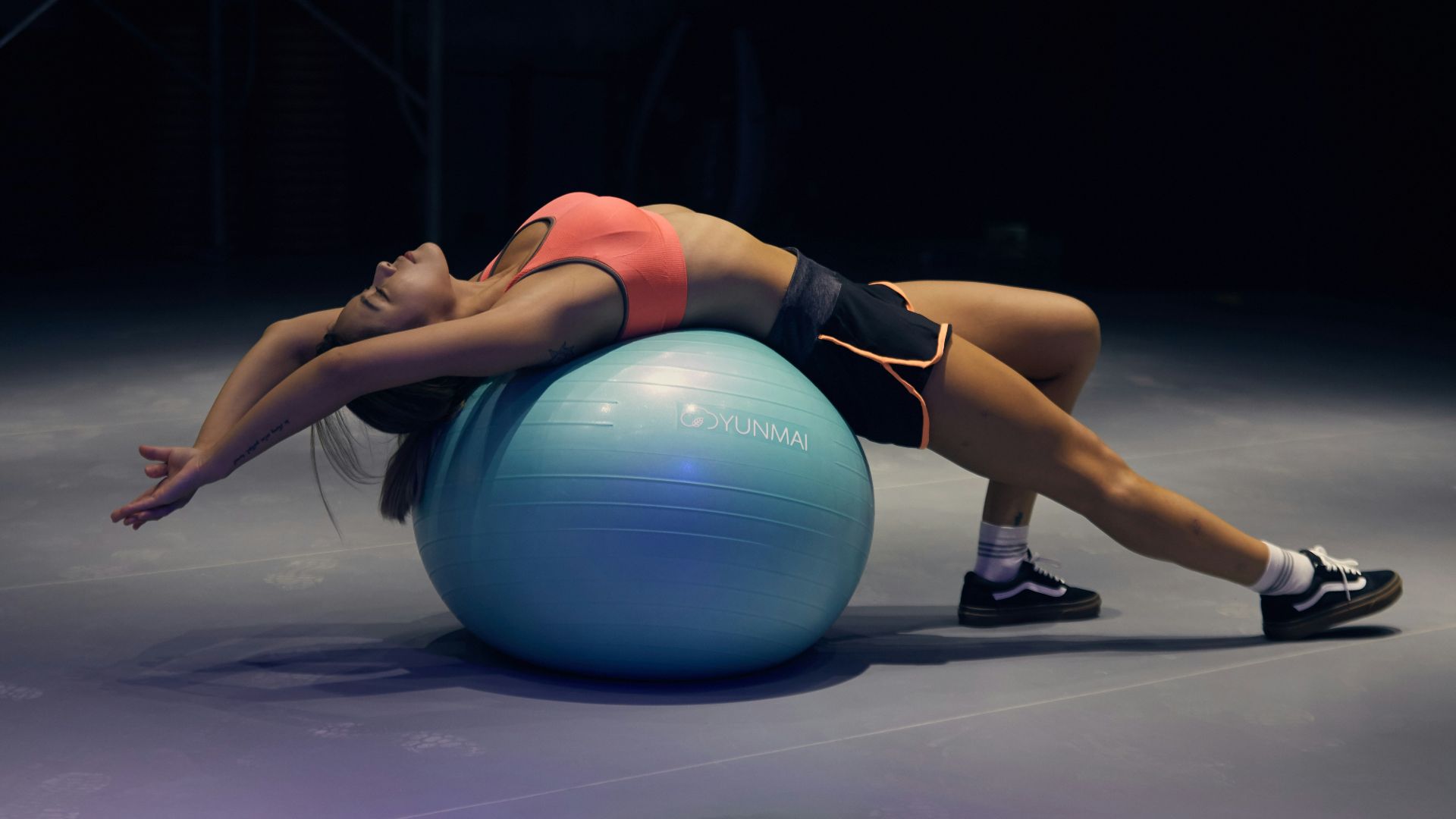 woman doing yoga on stability ball