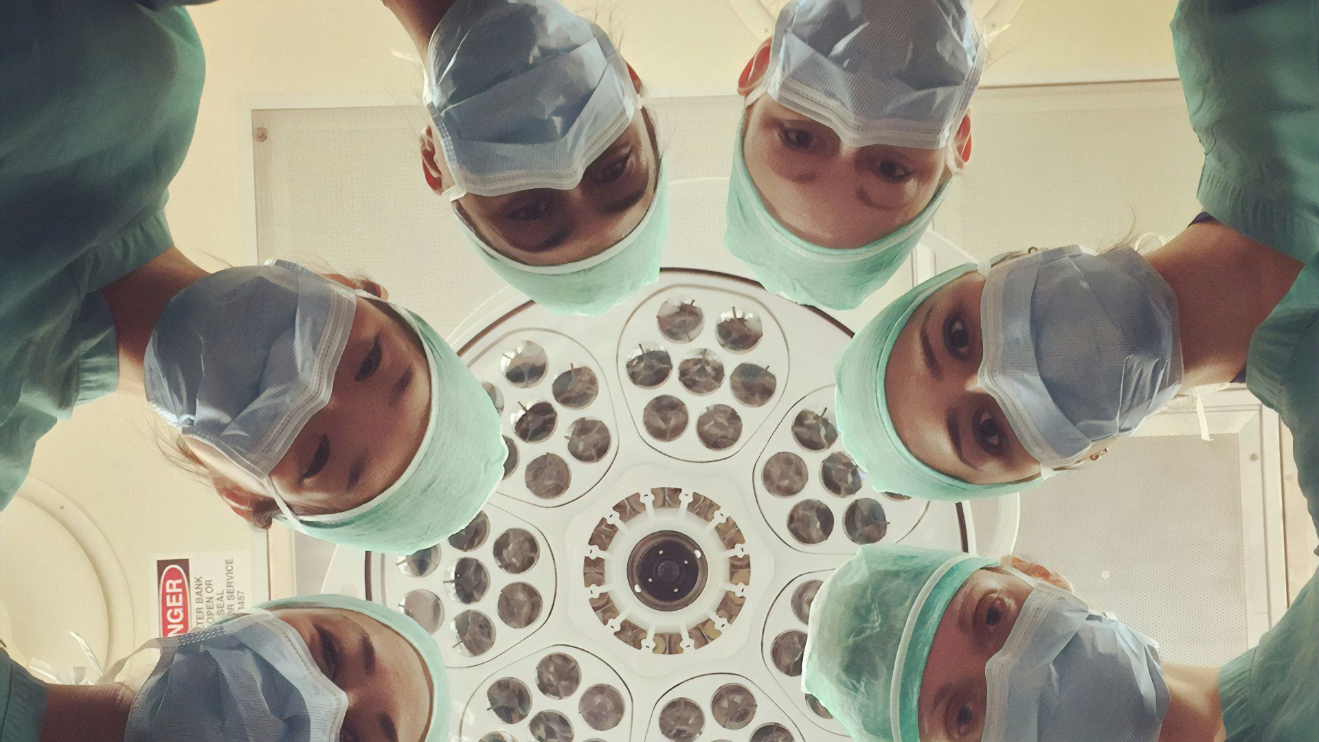 people in white shirt holding clear drinking glasses