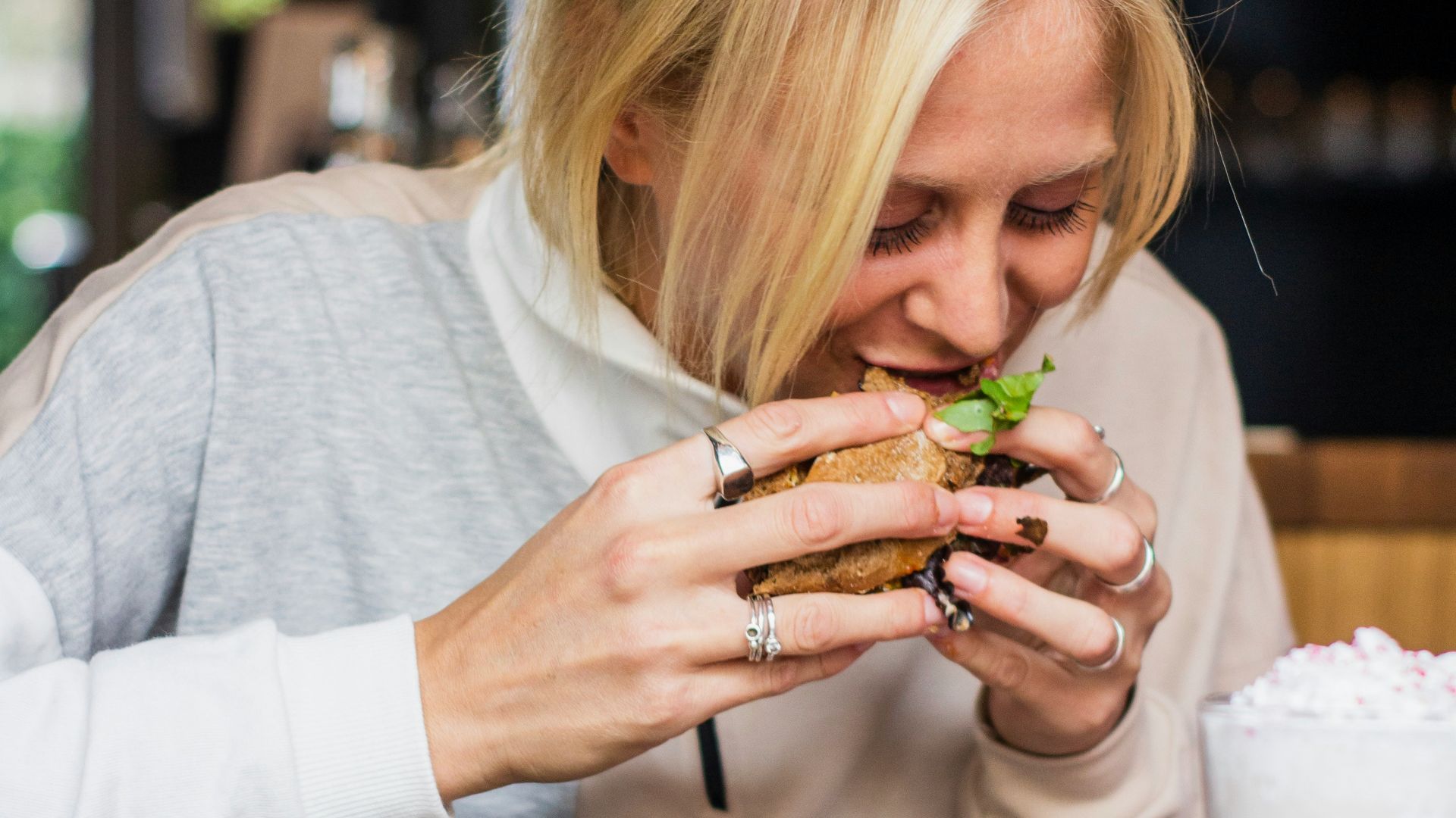 woman eating burger
