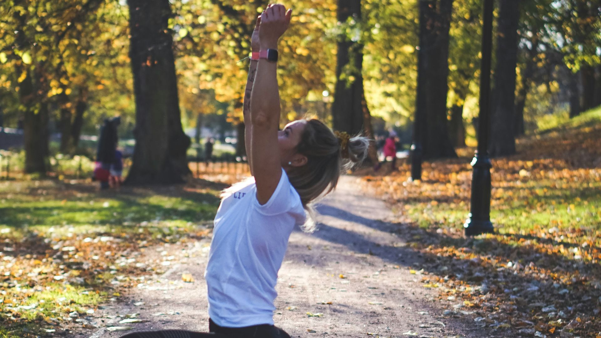 woman stretching on pathway