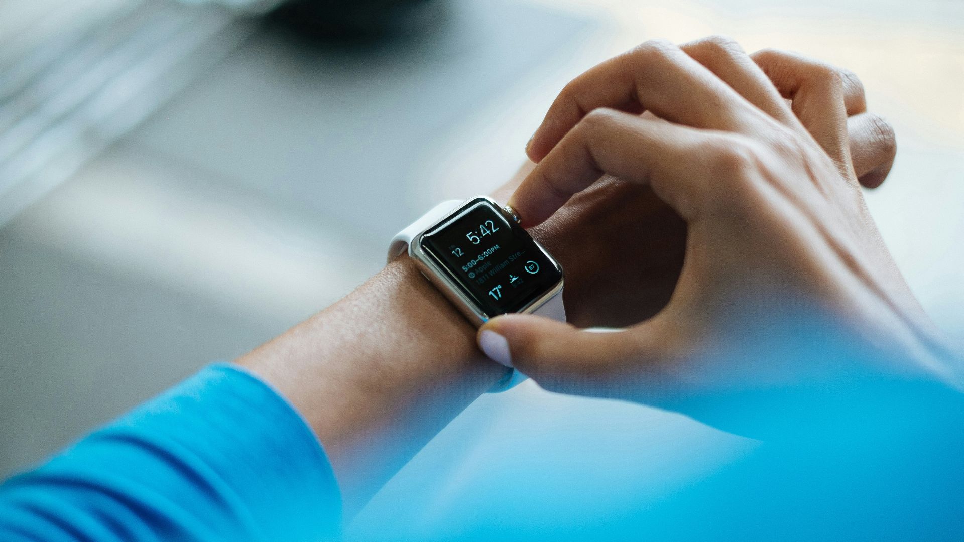 person clicking Apple Watch smartwatch