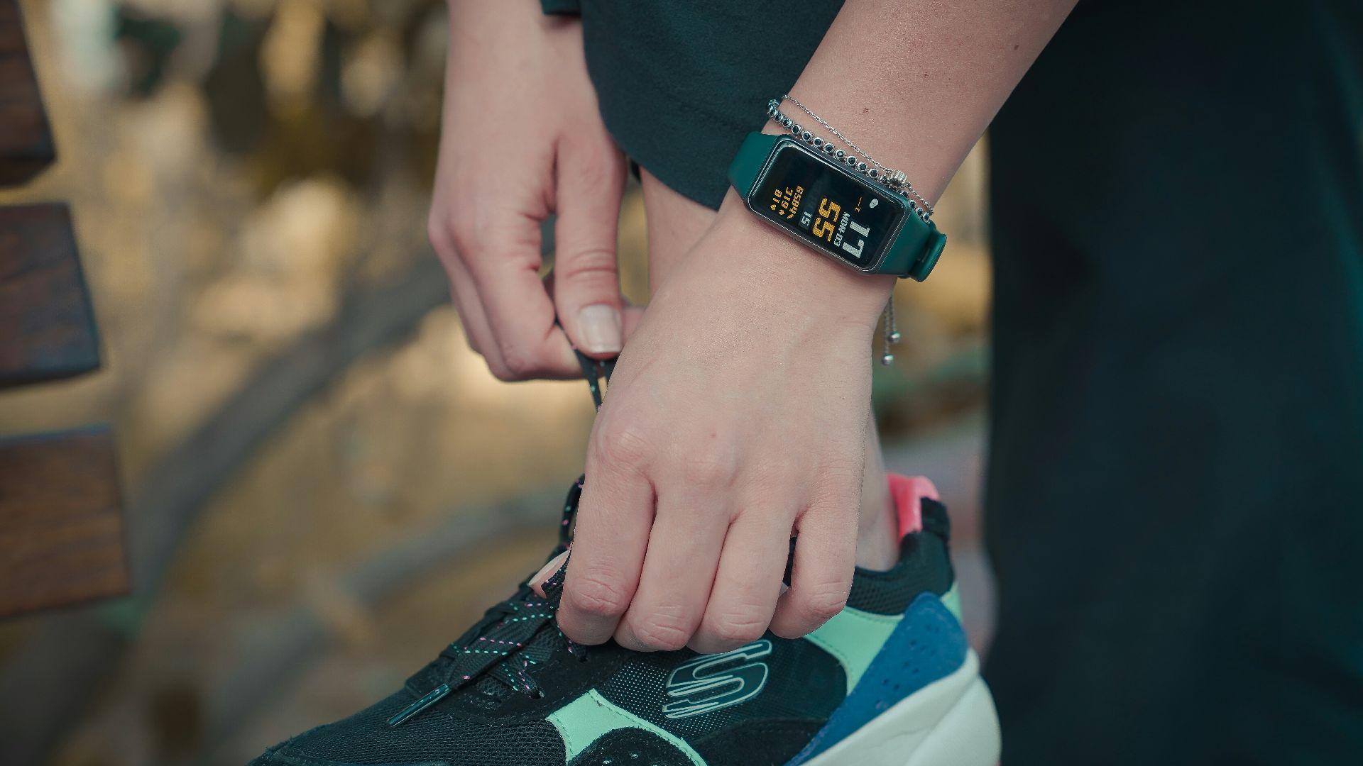 person wearing black and green nike air max