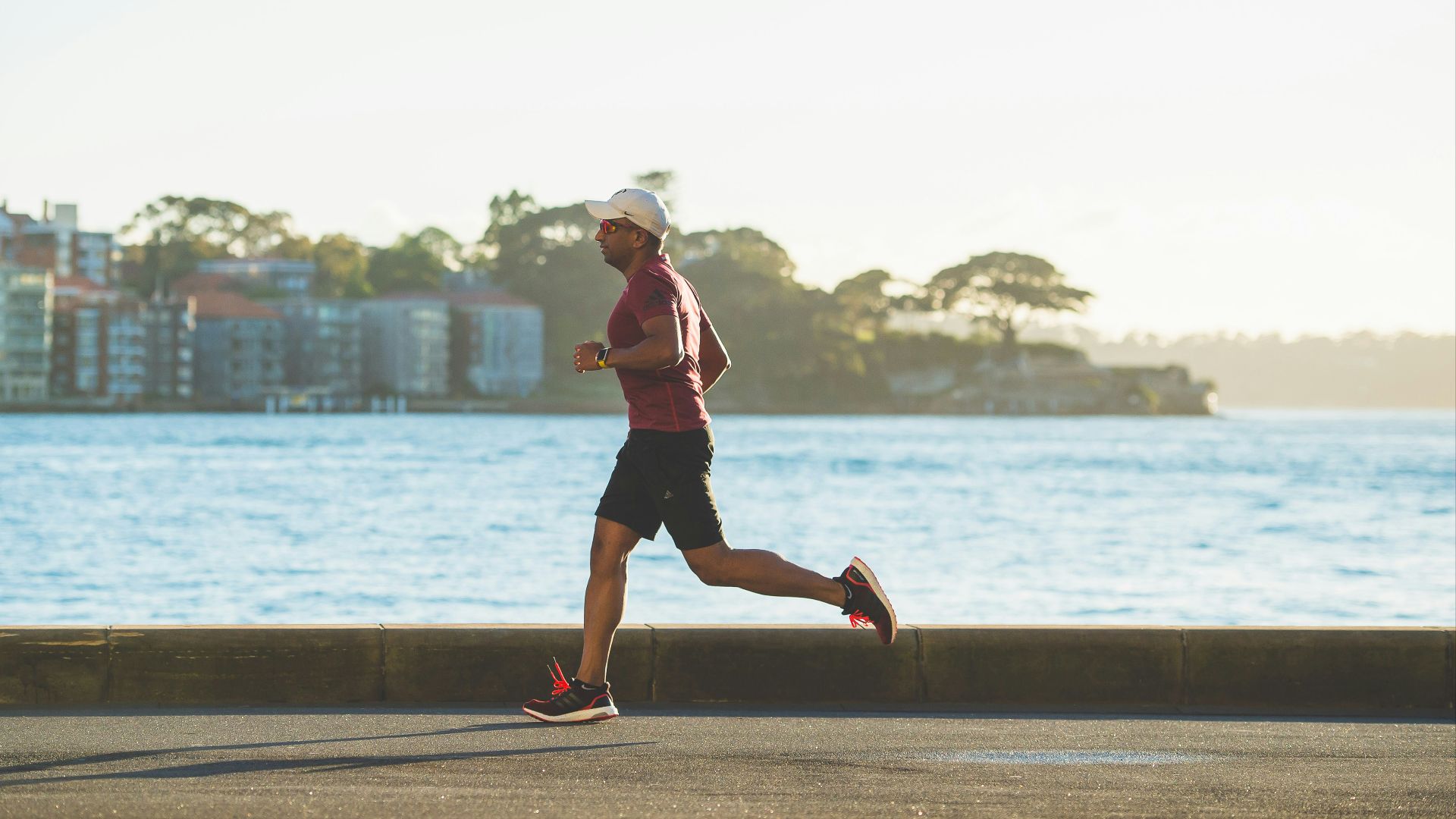 man running near sea during daytime