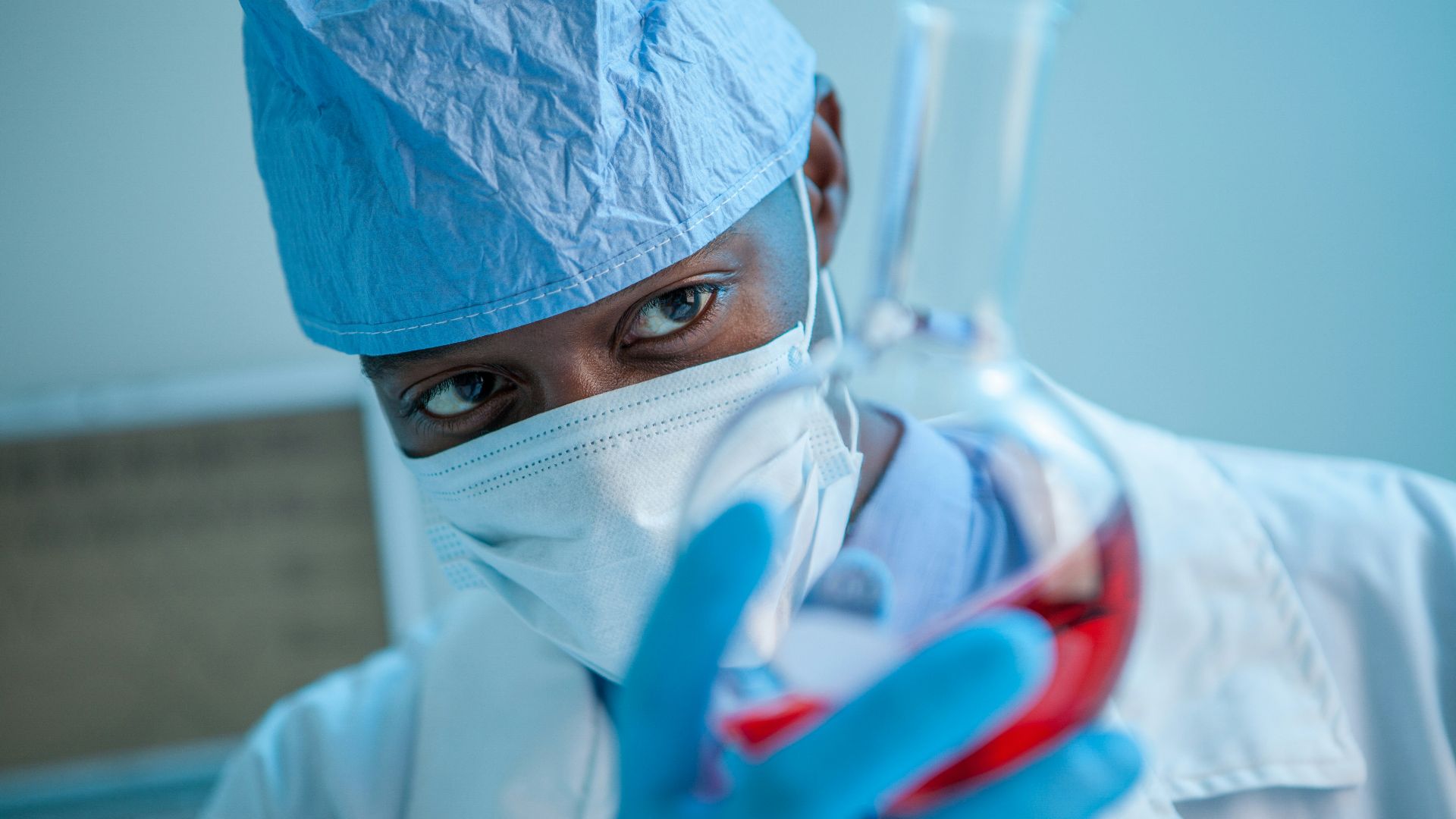 person in white face mask