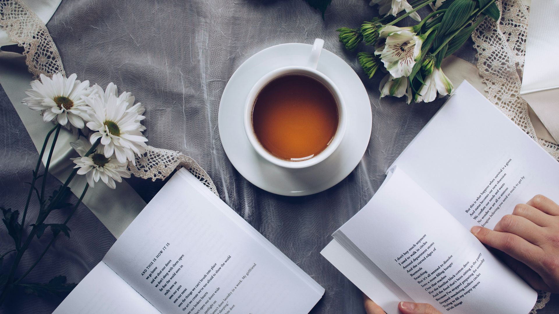 white cup with saucer near bok