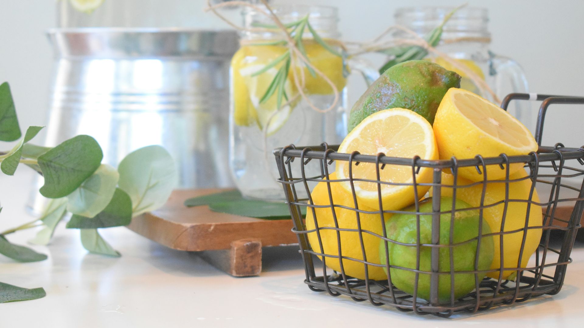 green lemon fruit in black metal basket