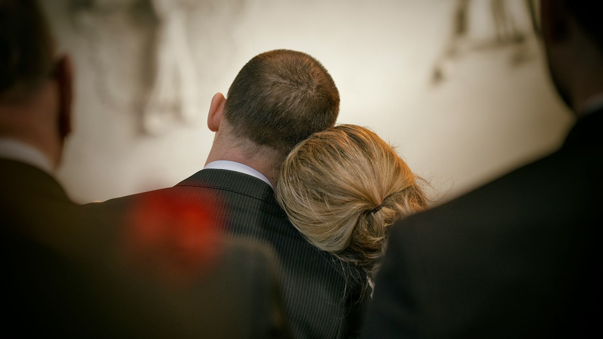 a man and a woman looking at the camera